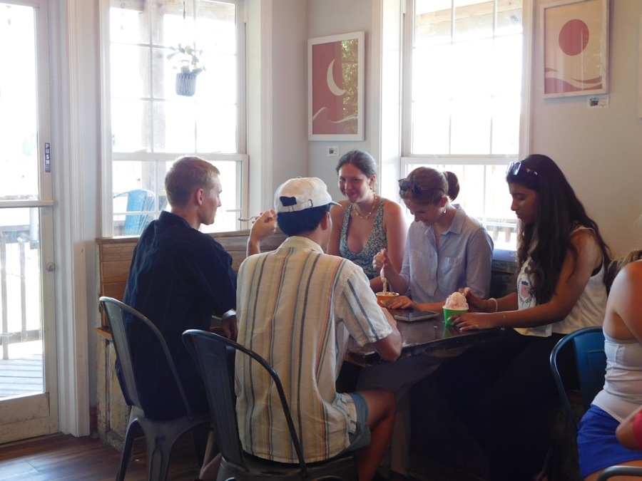 Young adults talking together around a table